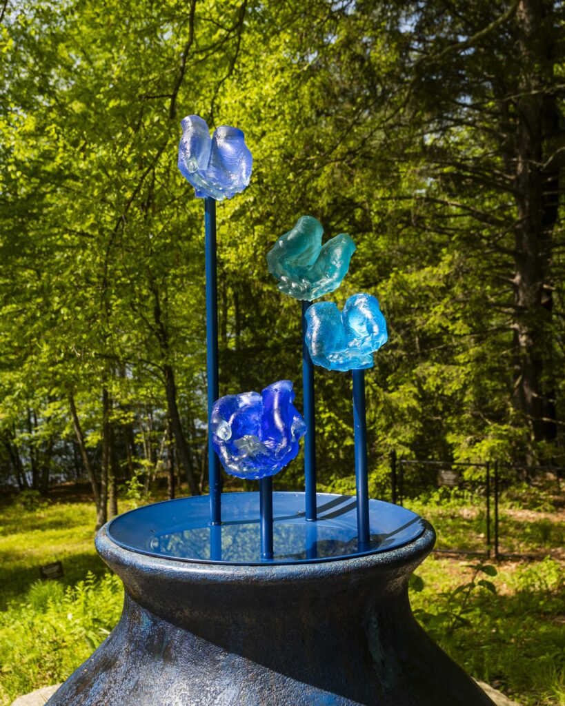 EVELYN RYDZ, Holding Water, 2025, Cast Glass, Steel, Concrete and Field Stones